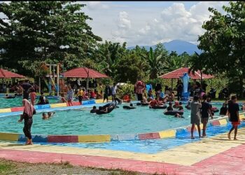 Libur Tahun Baru 2025, Wisata Permandian Telaga Biru Ramai Pengunjung